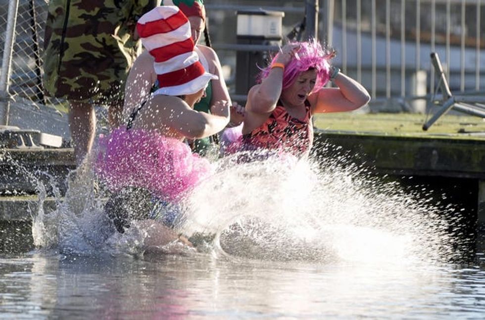 Two women in fancy dress in the water