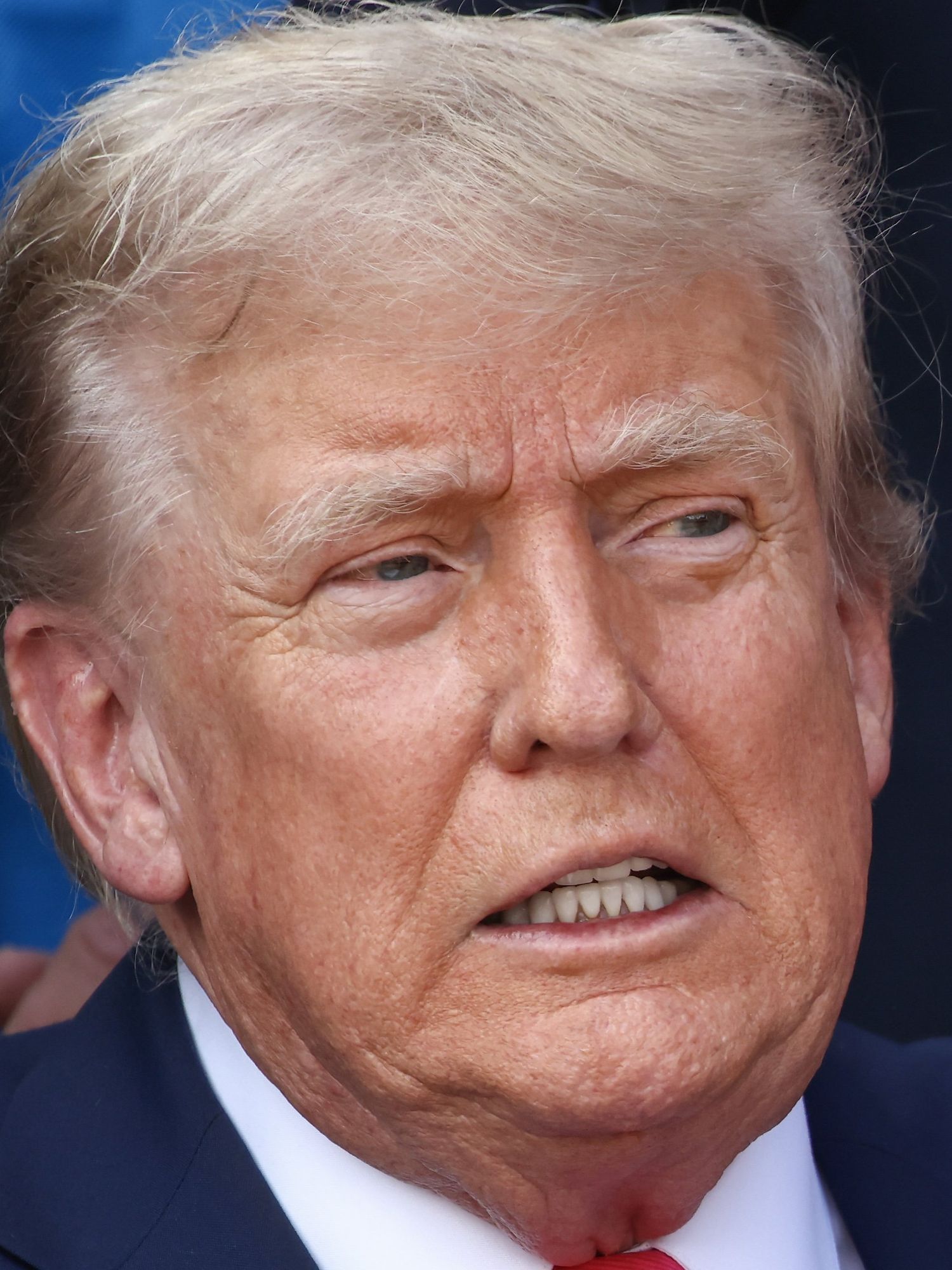 U.S. President Donald Trump, joined by Republican lawmakers, signs the One, Big Beautiful Bill Act into law during an Independence Day military family picnic on the South Lawn of the White House on July 04, 2025 in Washington, DC