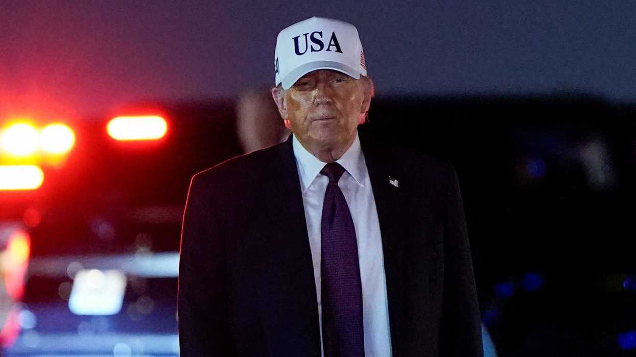 U.S. President Donald Trump looks on after disembarking Air Force One at Palm Beach International Airport in West Palm Beach, Florida, U.S.