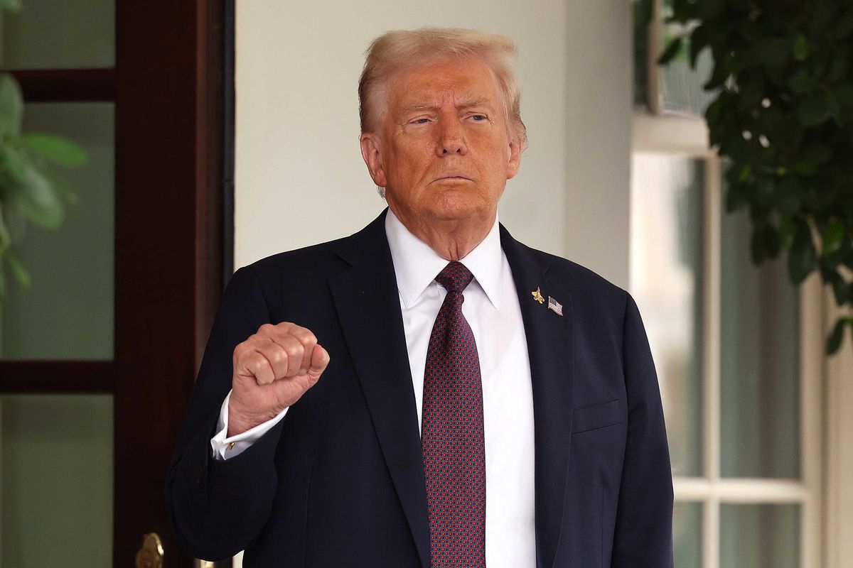 U.S. President Donald Trump pumps his first as he waits to welcome Israeli Prime Minister Benjamin Netanyahu at the White House on September 29, 2025 in Washington, DC