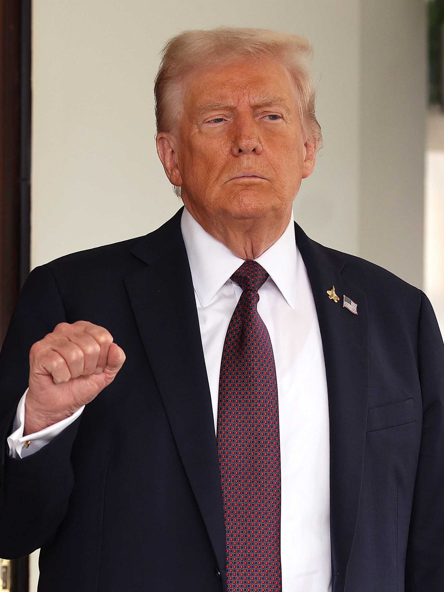 U.S. President Donald Trump pumps his first as he waits to welcome Israeli Prime Minister Benjamin Netanyahu at the White House on September 29, 2025 in Washington, DC