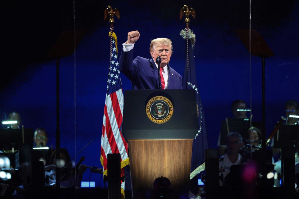 U.S. President Donald Trump raises his fist while speaking at "Salute to America 250" Fourth of July celebrations on the National Mall on July 04, 2026 in Washington, DC. Americans are celebrating the nation\u2019s 250th anniversary amidst an extreme heat wave bringing dangerous triple digit temperatures to much of the eastern United States