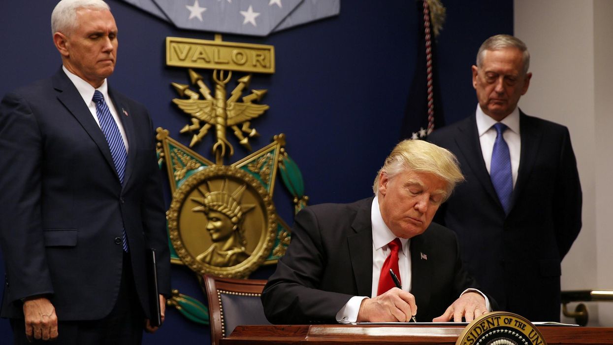 U.S. President Donald Trump signs a revised executive order for a U.S. travel ban at the Pentagon in Washington. Picture: