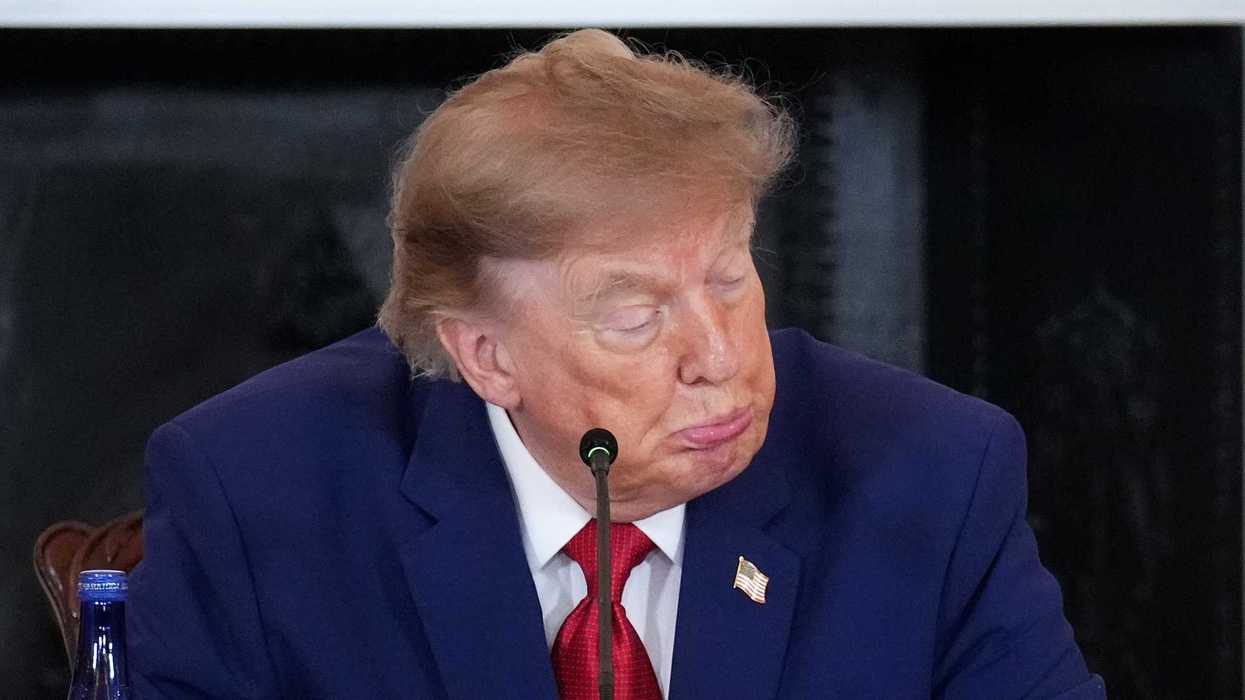 U.S. Secretary of State Marco Rubio (R) looks on as U.S. President Donald Trump speaks during a roundtable on the American mining industry at the U.S. Department of State on August 07, 2026 in Washington, DC