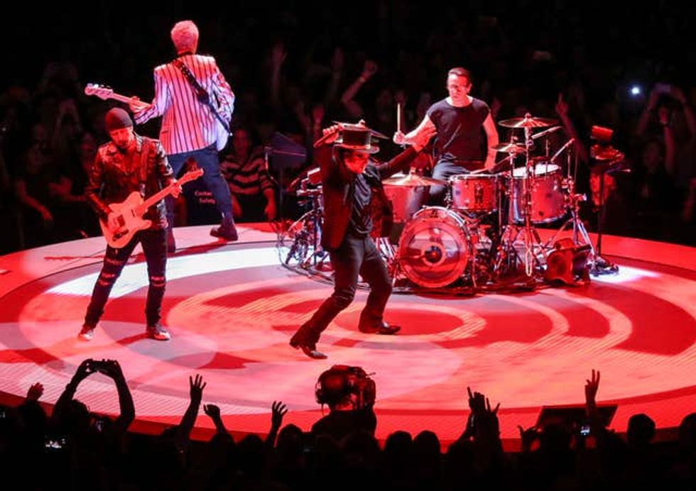 U2 perform on stage