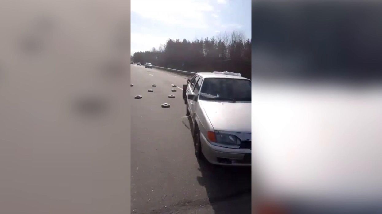 Fearless Ukrainians drive straight over land mines on Kyiv roads