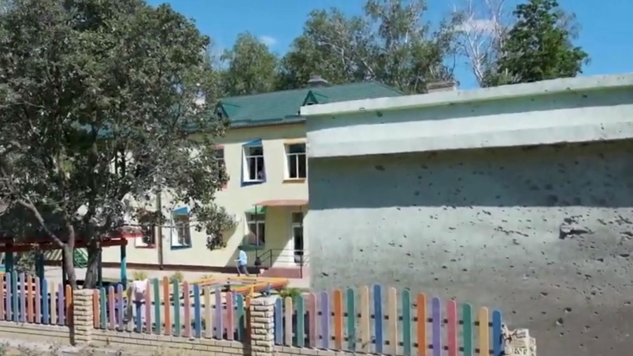 Viral clip shows Ukrainian man shaving his beard with a missile wedged in his home