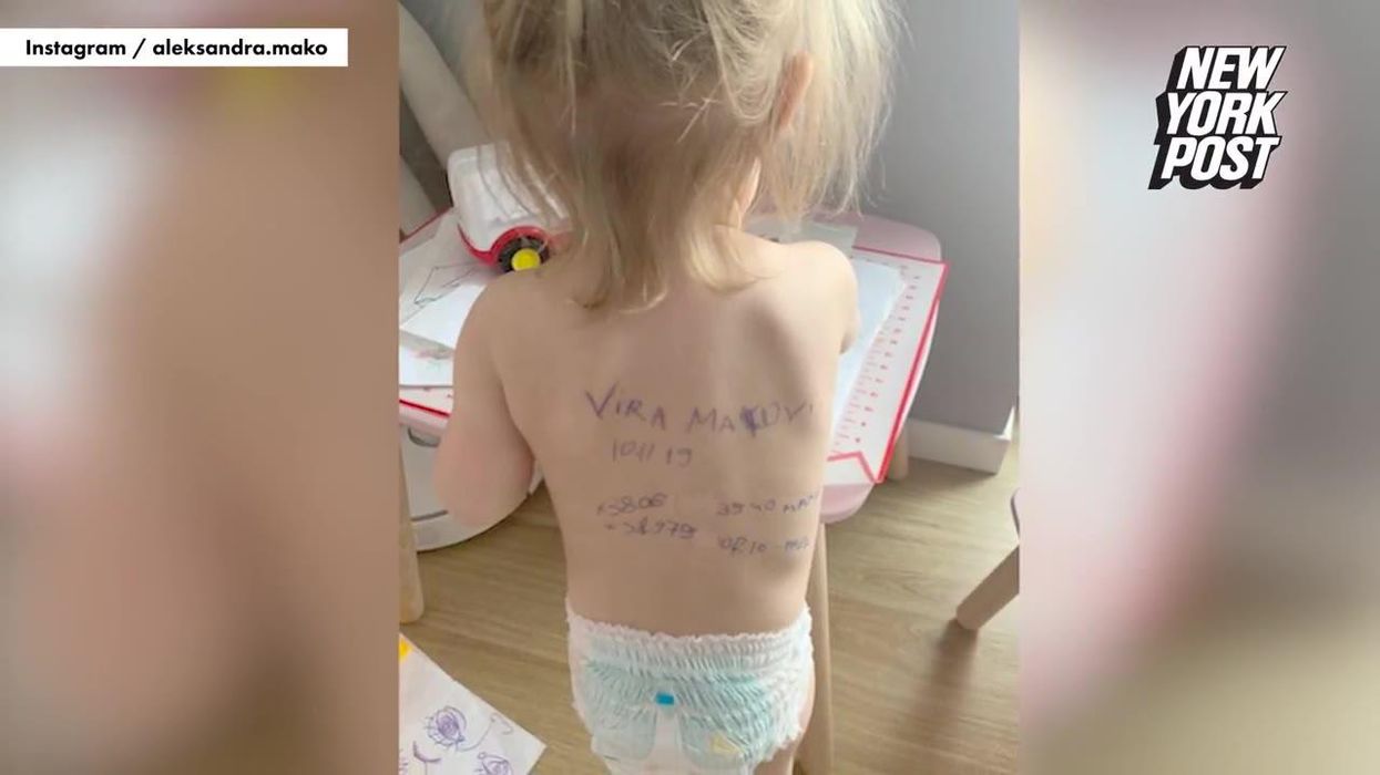 Ukrainian mum writes details on toddler's back in case they get separated