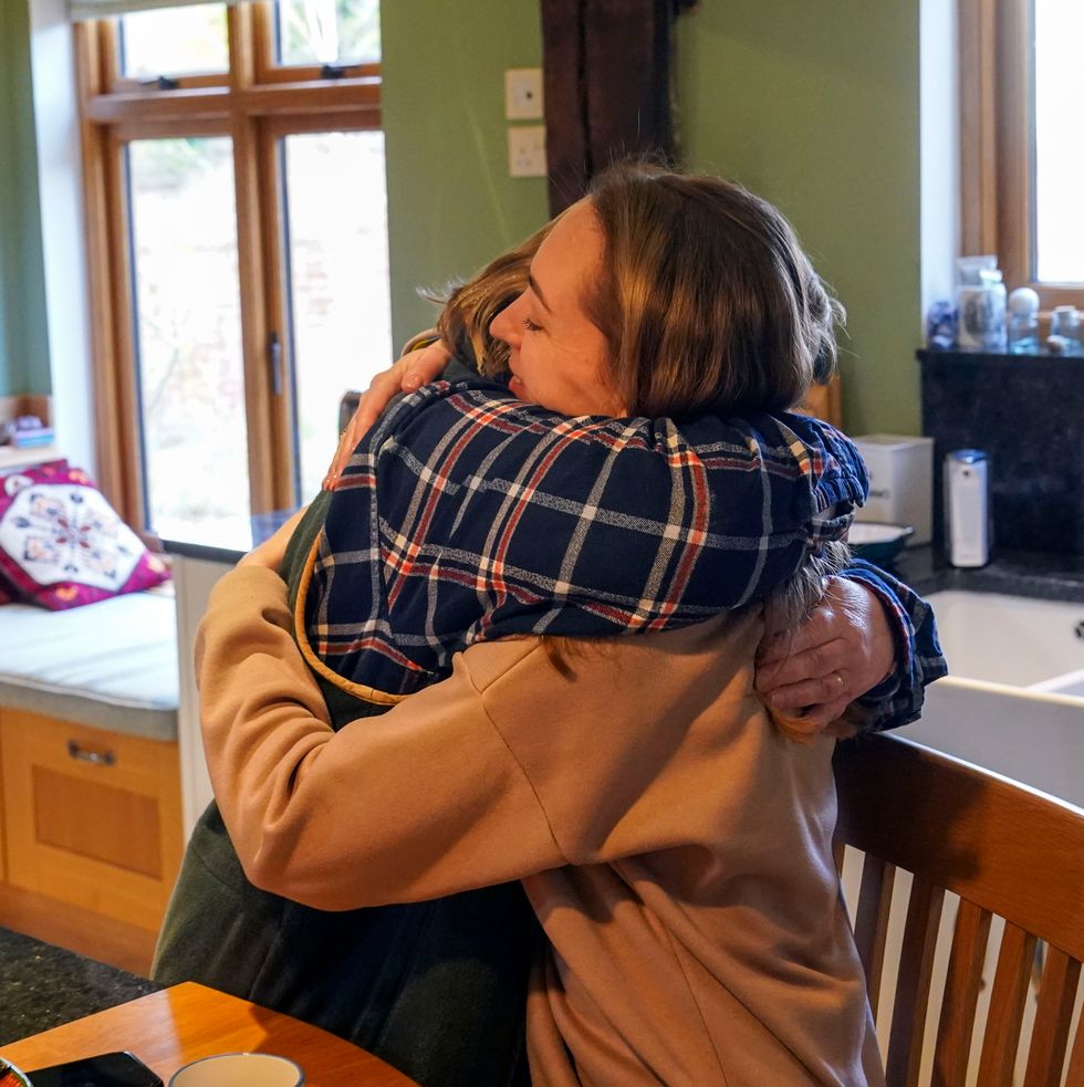 Ukrainian refugees Irina Kryvoviaz (right) with their host Sarah Allen-Stevens as they settle into their new home in North Moreton, Oxfordshire