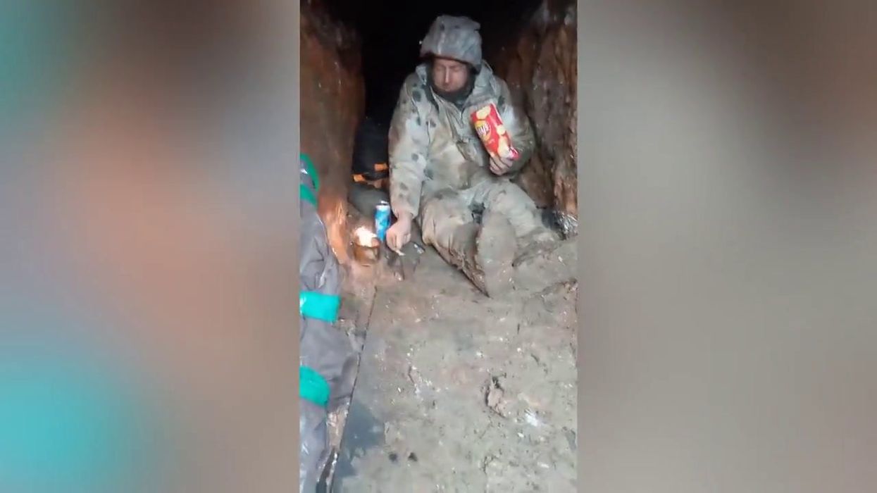 Sweet moment Ukrainian soldier shares food with a little mouse