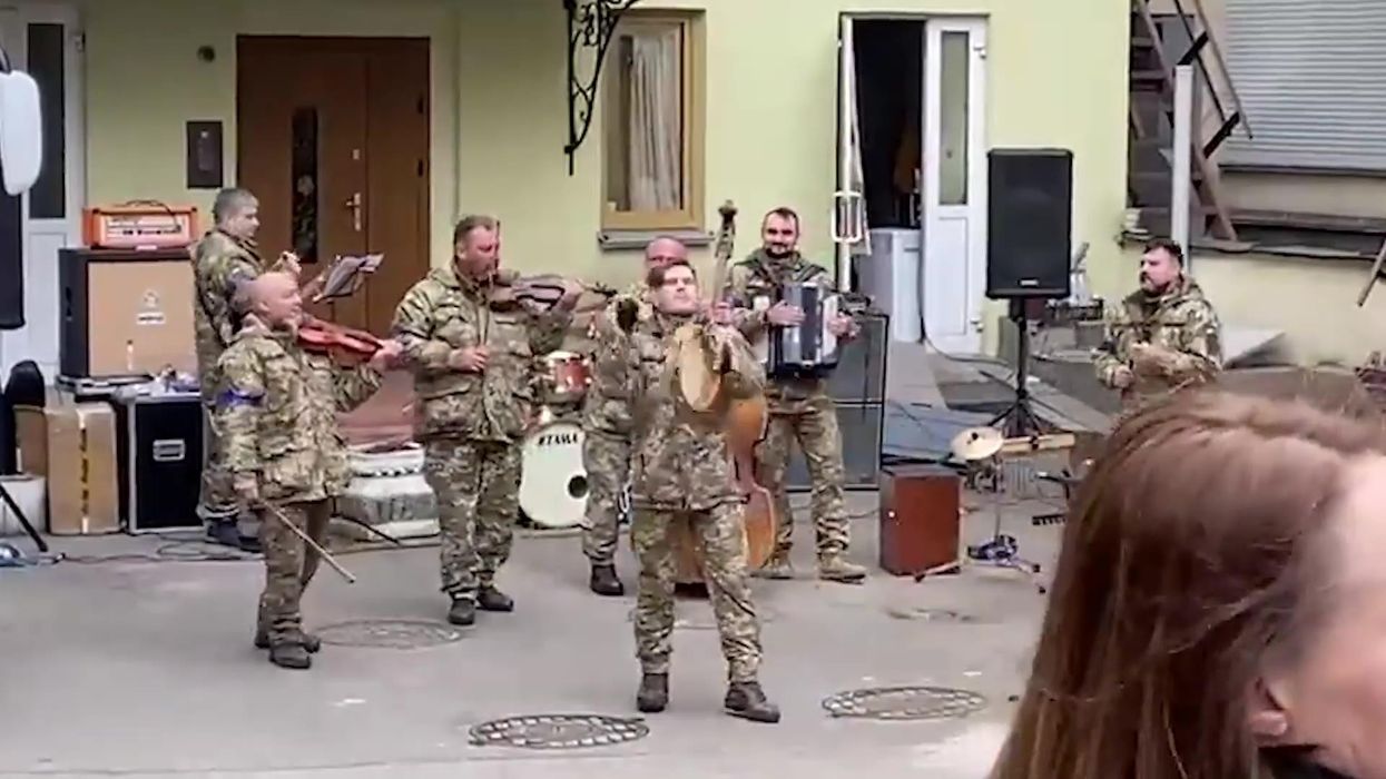 Crowds gather in downtown Kyiv for an impromptu performance by the military