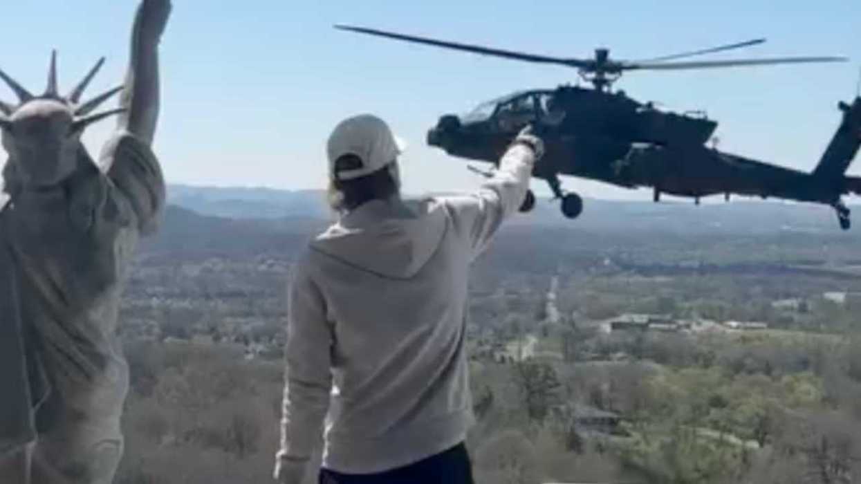'No joke is as funny as our reality': Outrage as Kid Rock takes 'joyride' in Army helicopters