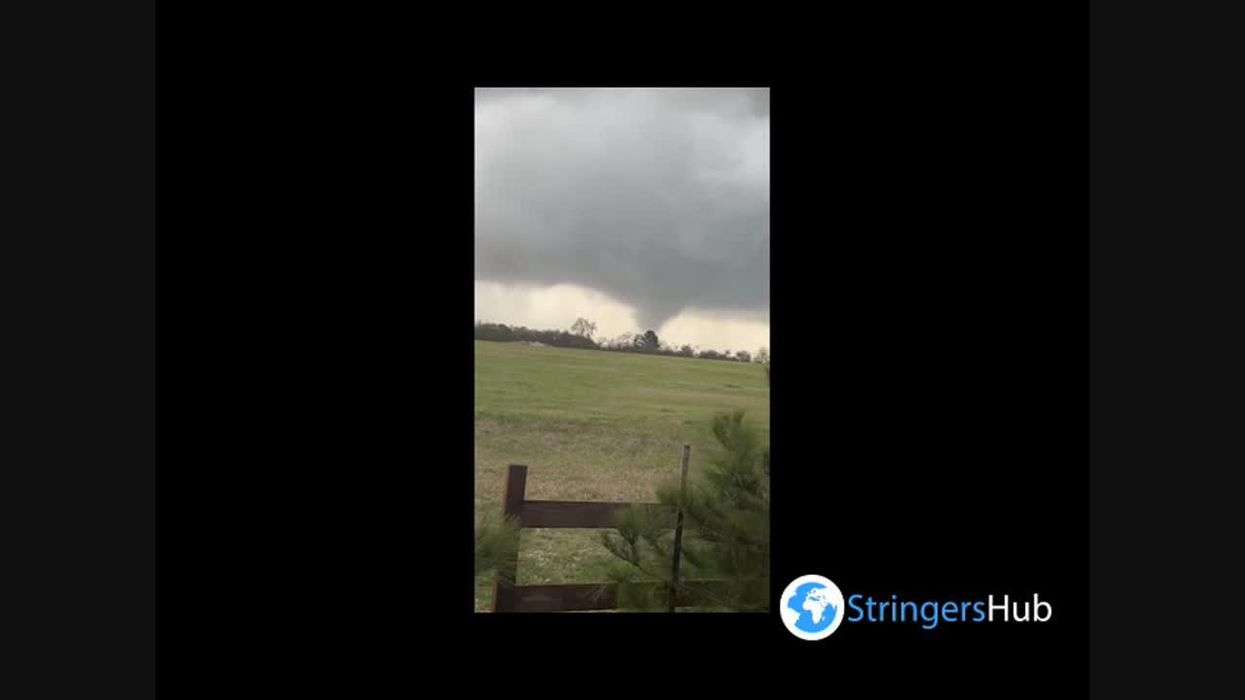 Woman shows the results of being dragged across a 'Walmart parking lot by a tornado'