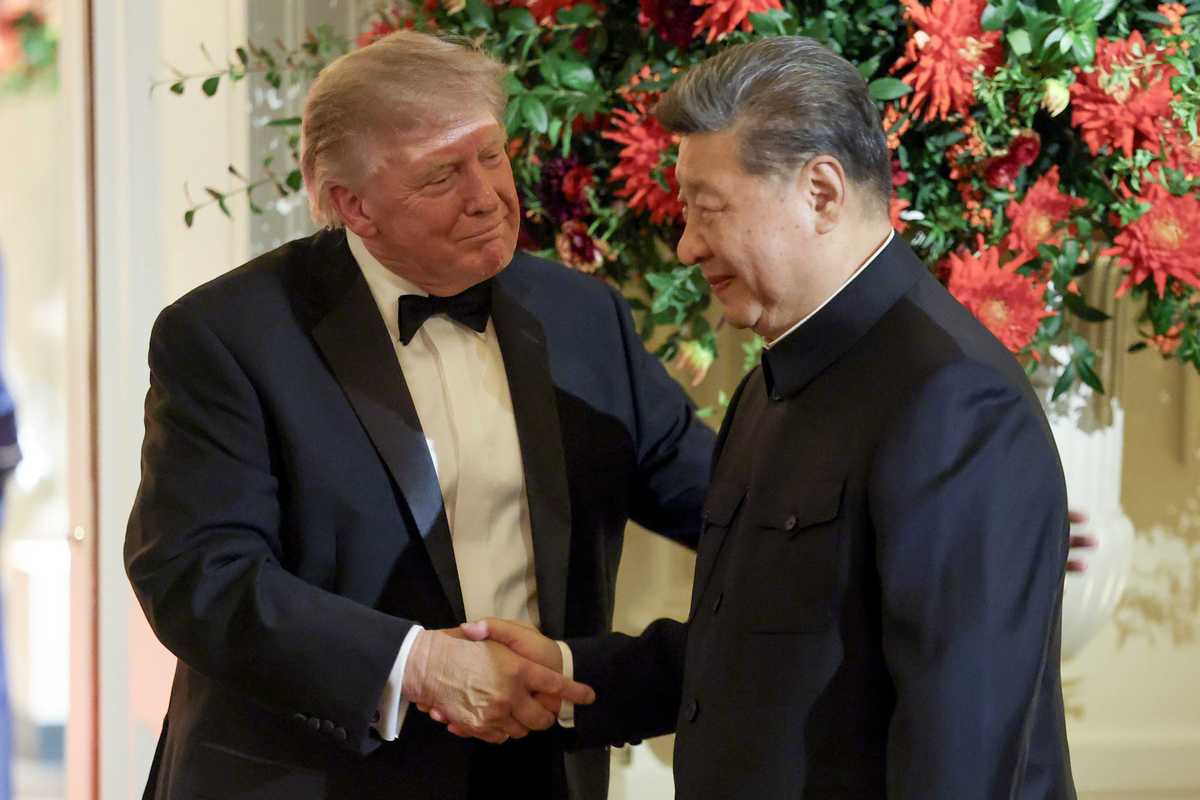 US president Donald Trump shakes hands with Xi Jinping during a state dinner.
