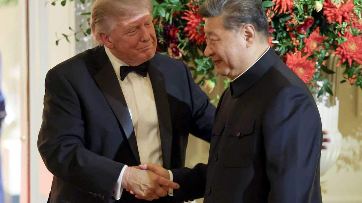 US president Donald Trump shakes hands with Xi Jinping during a state dinner.