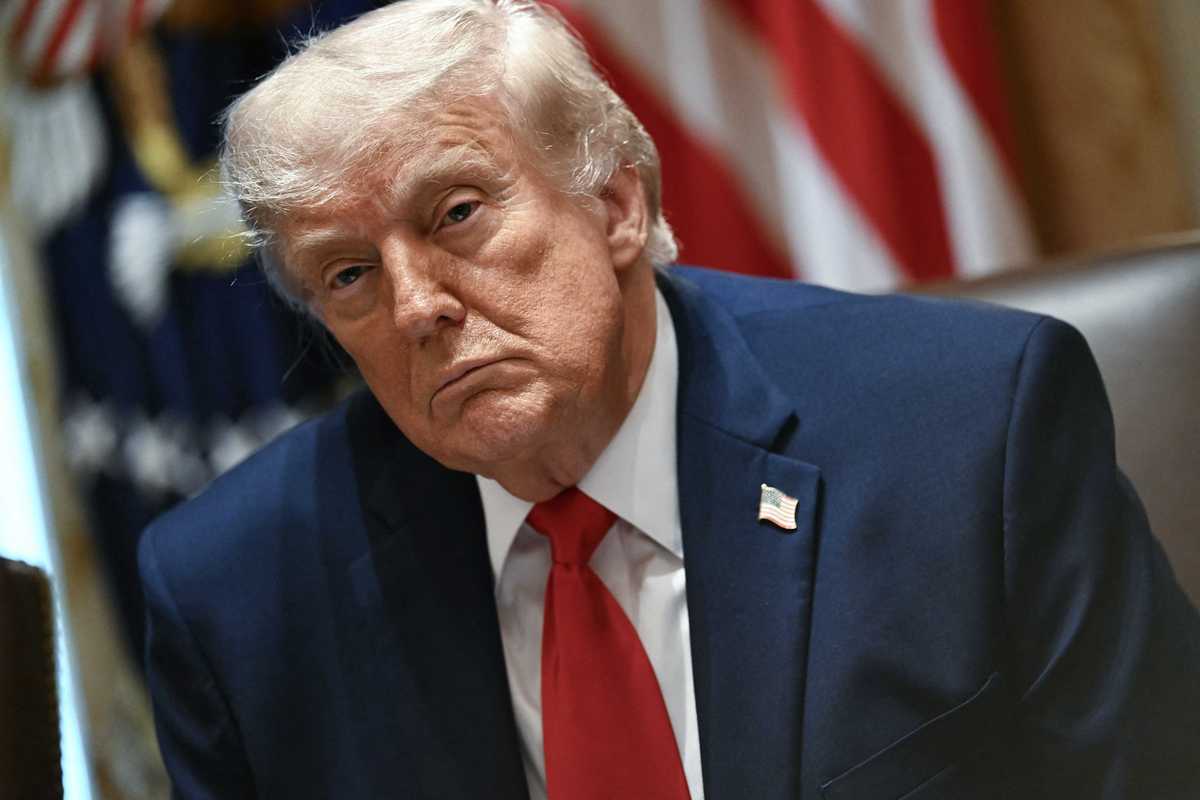 US president Donald Trump sitting in the Cabinet Room of the White House.