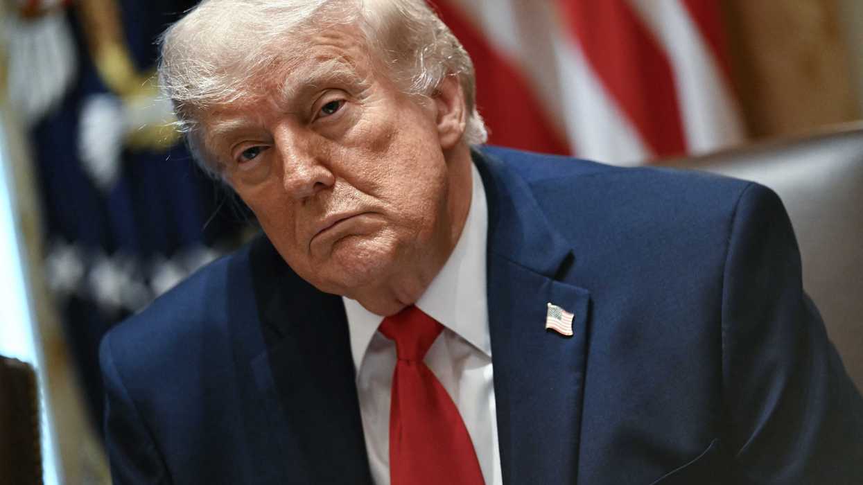 US president Donald Trump sitting in the Cabinet Room of the White House.
