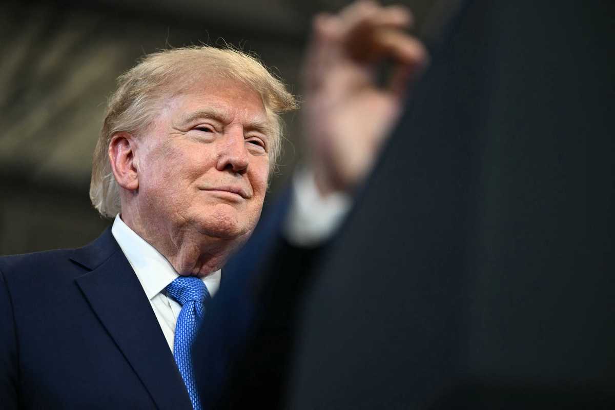 US president Donald Trump smiling at a rally in Long Island, New York.