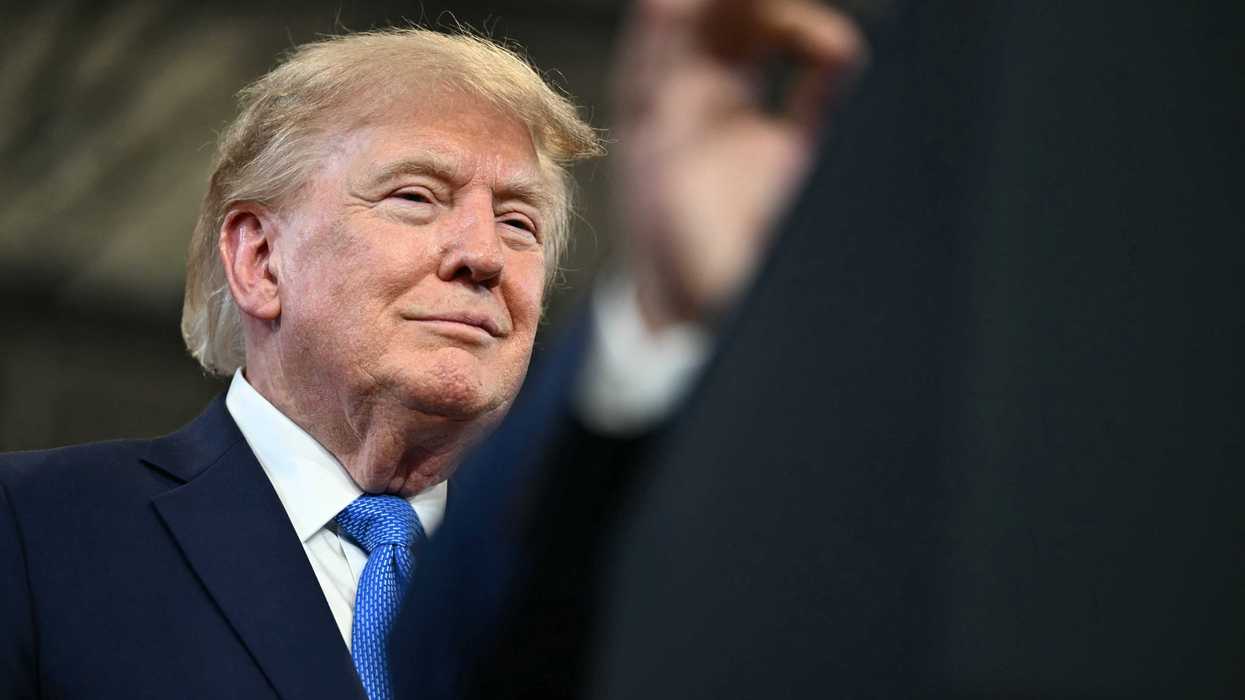 US president Donald Trump smiling at a rally in Long Island, New York.