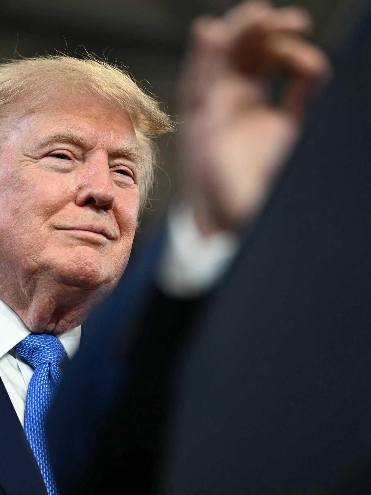 US president Donald Trump smiling at a rally in Long Island, New York.
