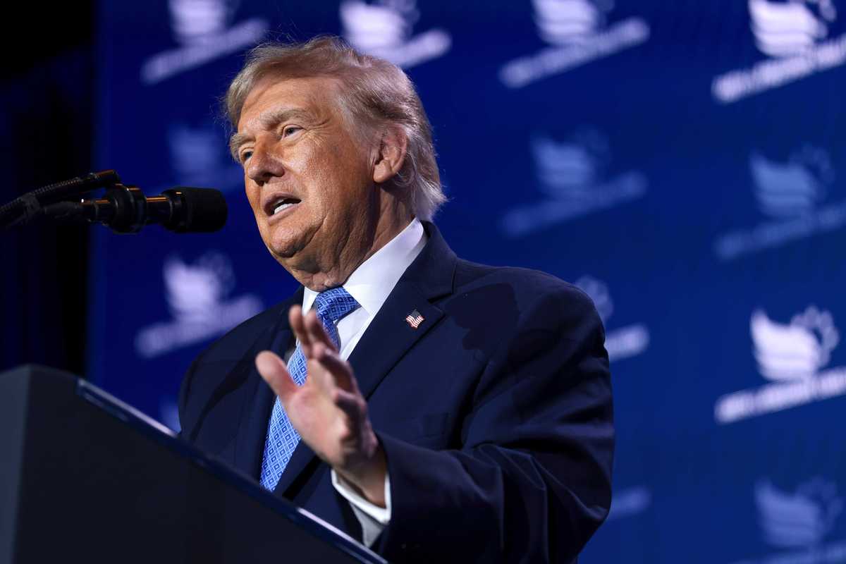 US president Donald Trump speaks behind a lectern at the Faith and Freedom policy conference in Washington, D.C.