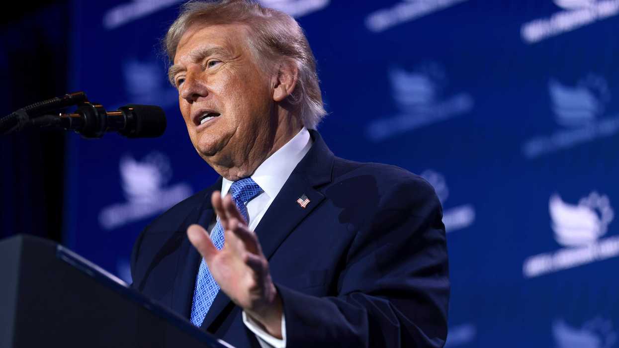 US president Donald Trump speaks behind a lectern at the Faith and Freedom policy conference in Washington, D.C.