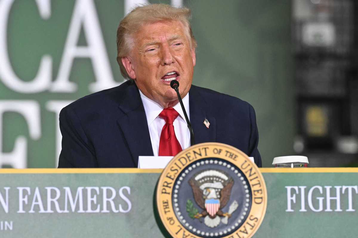 US president Donald Trump speaks behind a table at an agriculture roundtable in Wisconsin.