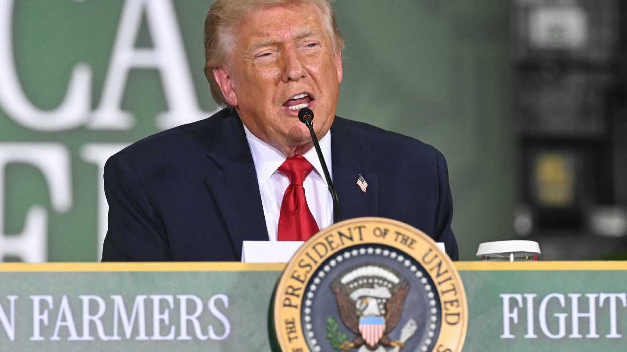 US president Donald Trump speaks behind a table at an agriculture roundtable in Wisconsin.