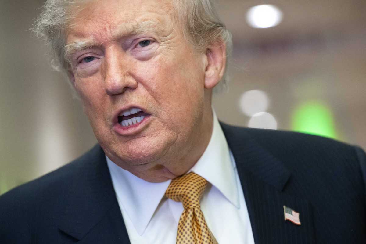 US President Donald Trump speaks with the media aboard Air Force One shortly after departure from Mildenhall Air Force Base in the United Kingdom, after he switched from the old VC-25A Air Force One to the newer VC-25B Bridge Air Force One, enroute to Washington, on July 8, 2026