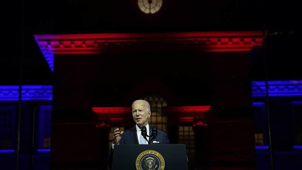 Biden goes full Dark Brandon by trashing Trump on blood-red stage with silhouetted marines