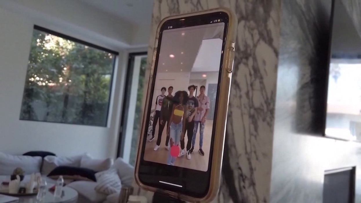 What is the 'grape theory' for New Year's Eve going viral on TikTok?