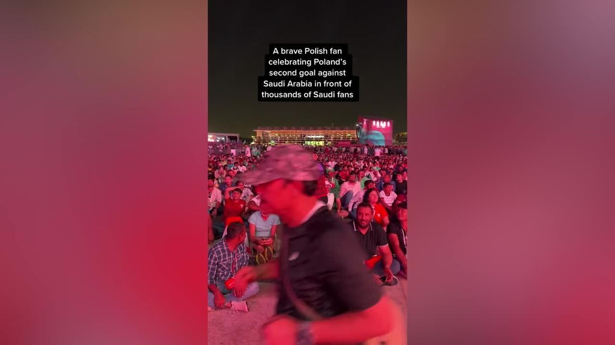 Very brave Poland fan celebrates in front of Saudi Arabia fans during World Cup game