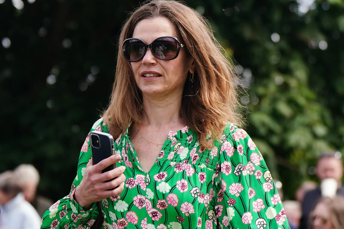 Victoria Starmer wears green floral dress during appearance at Sandown races
