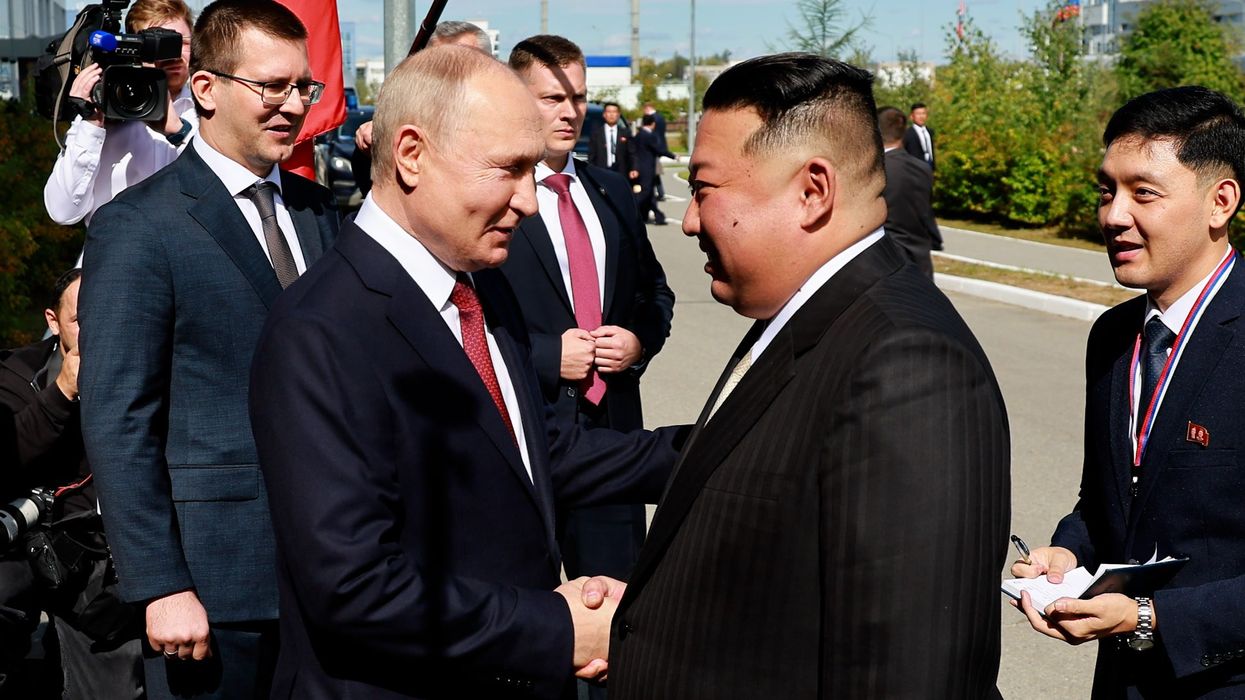 Kim Jong-un and Putin engage in bizarre 40-second handshake