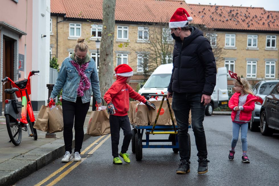 Volunteers delivering boxes during last year\u2019s campaign (Love Your Neighbour/PA)