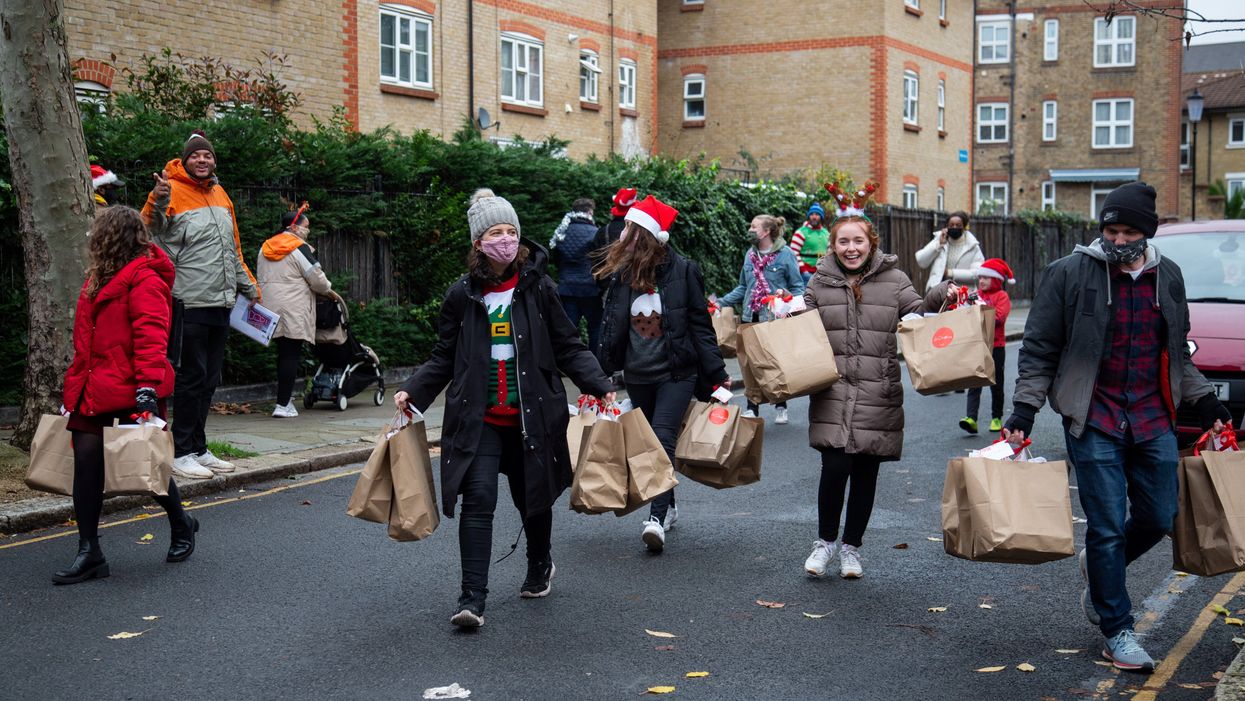 Volunteers delivering boxes during last year’s campaign (Love Your Neighbour/PA)