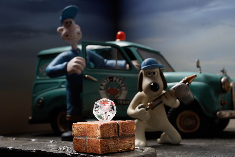 Wallace and Gromit with a Royal Mint coin