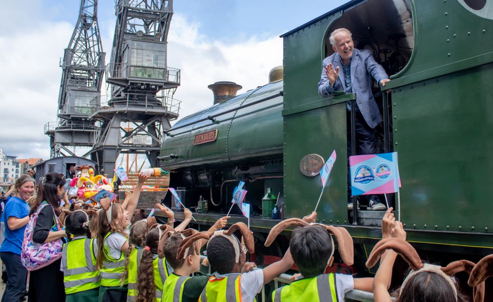 Wallace & Gromit creator Nick Park arrives by steam train on Bristol harbourside to launch Gromit Unleashed 3 (The Grand Appeal/PA)