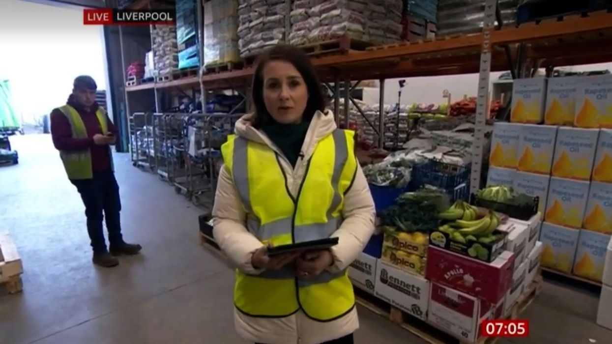 Warehouse worker panics as he's caught on live TV playing on phone