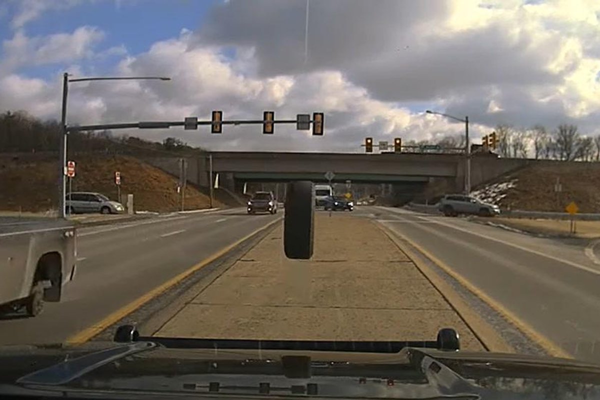 Watch moment rogue tyre smashes police car's windscreen