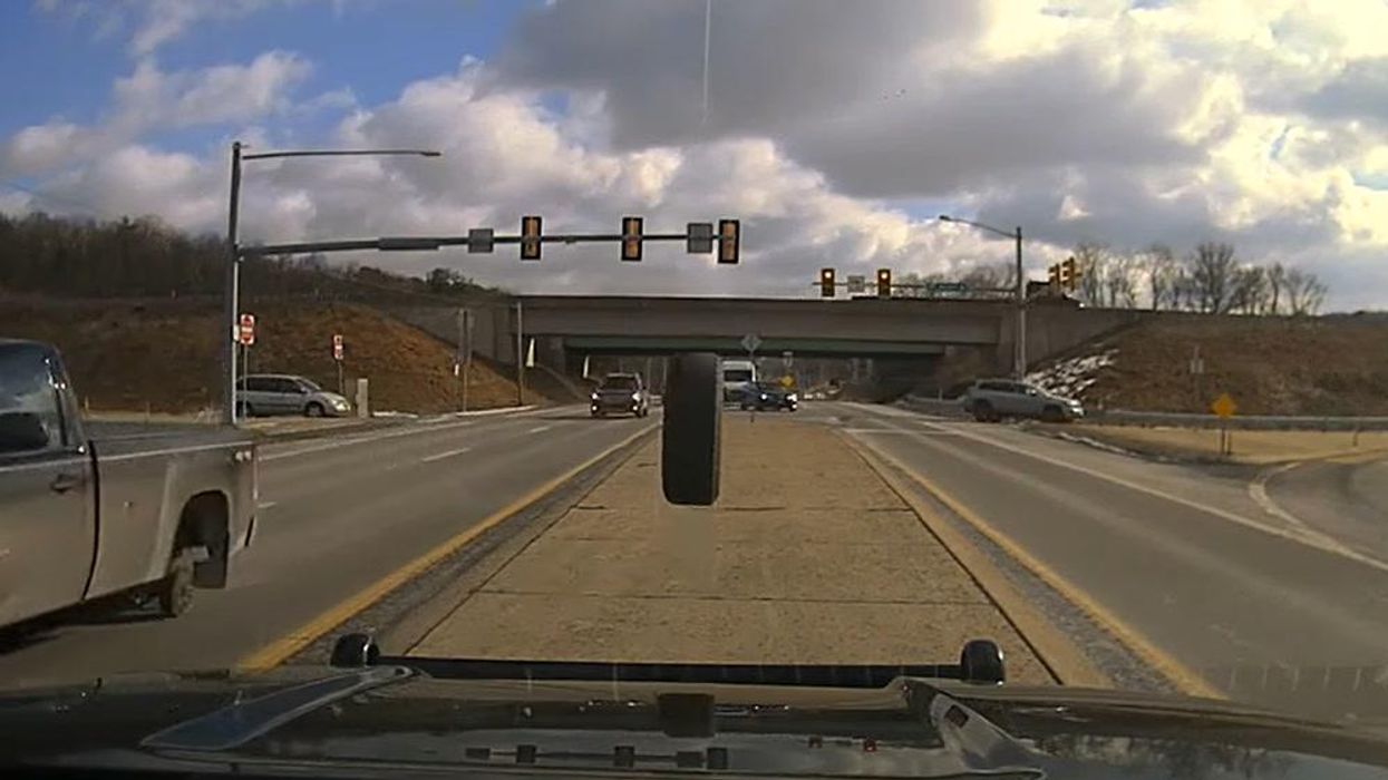 Police car windshield shattered by bouncing tyre during routine traffic observation