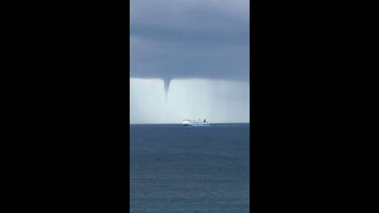 Watch as tornado whirls past cruise ship in dramatic footage