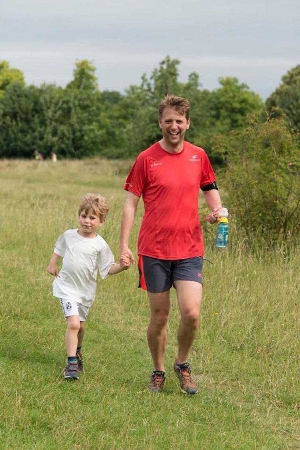 Wes Ball runs with his son William at a weekly Parkrun event in Buckinghamshire. (Wes Ball/PA)