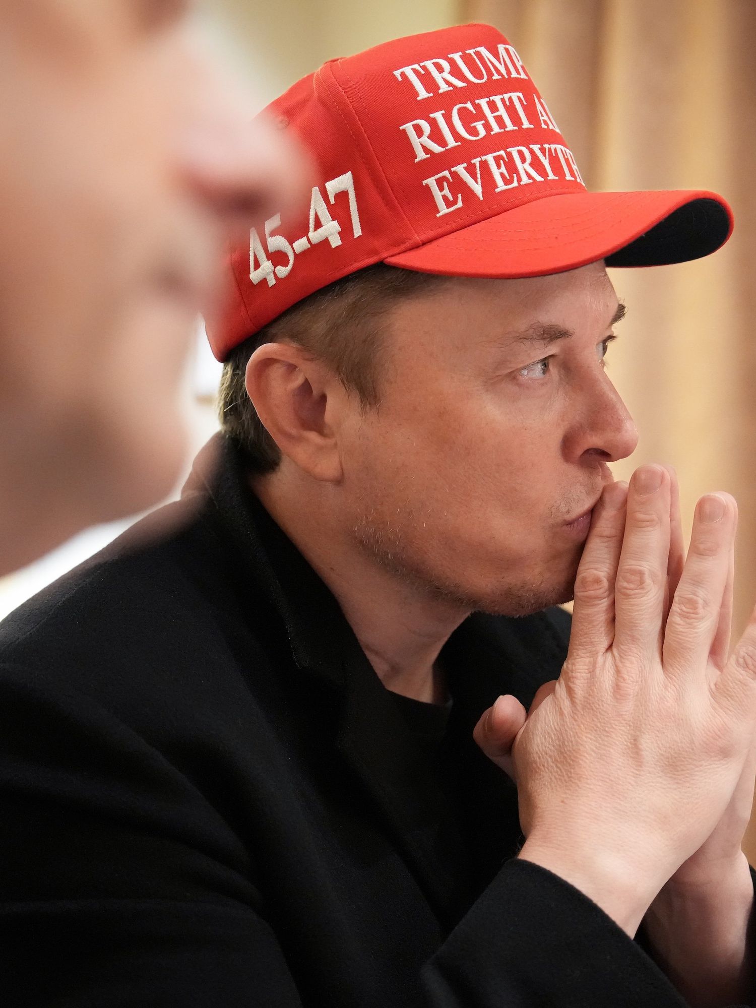 White House Senior Advisor, Tesla and SpaceX CEO Elon Musk (L) listens during a cabinet meeting held by U.S. President Donald Trump at the White House on March 24, 2025 in Washington, DC