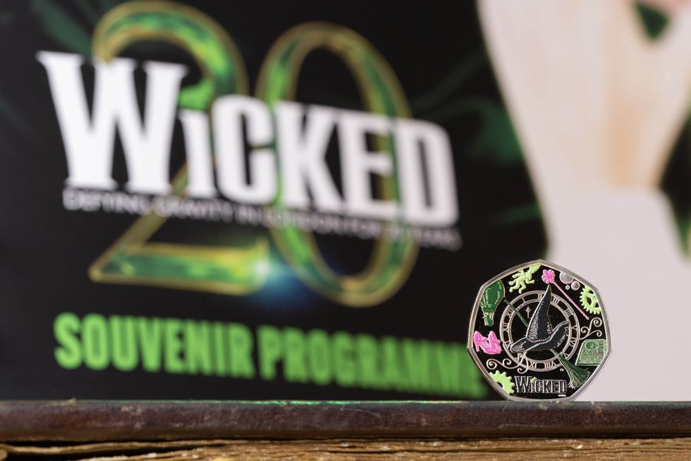 Wicked coin with a souvenir programme