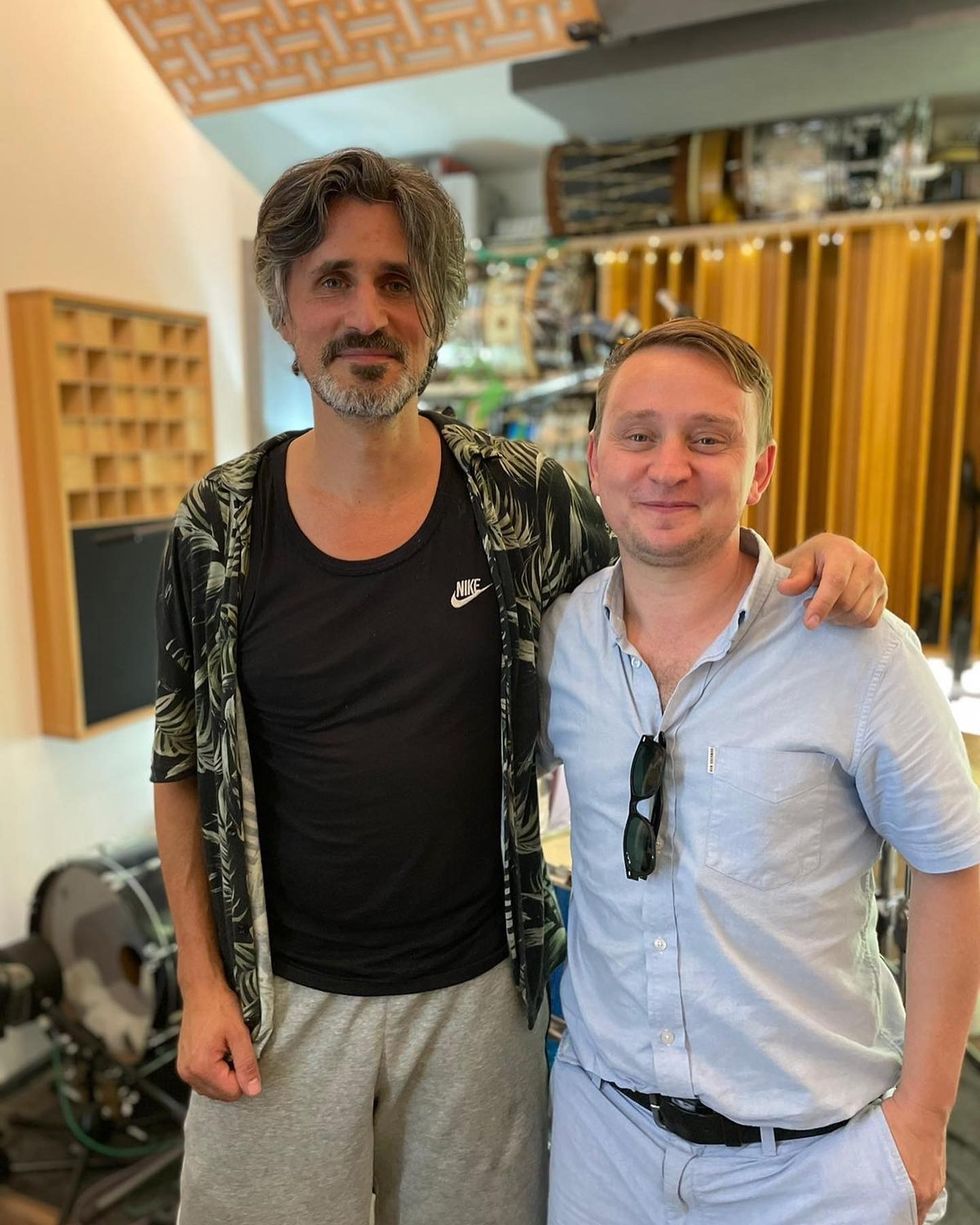 Wilfy Williams standing with Elbow drummer Alex Reeves
