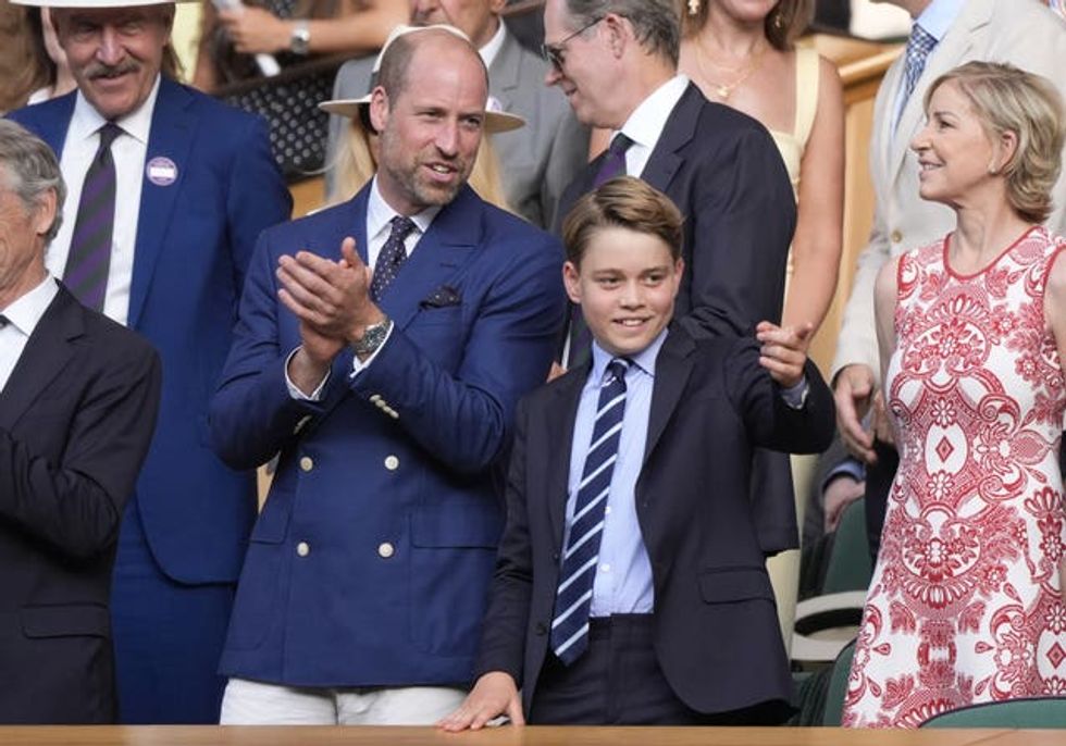 William and George stand in the Royal Box and clap at Wimbledon