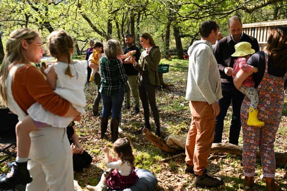 William and Kate mingling with families in a woodland