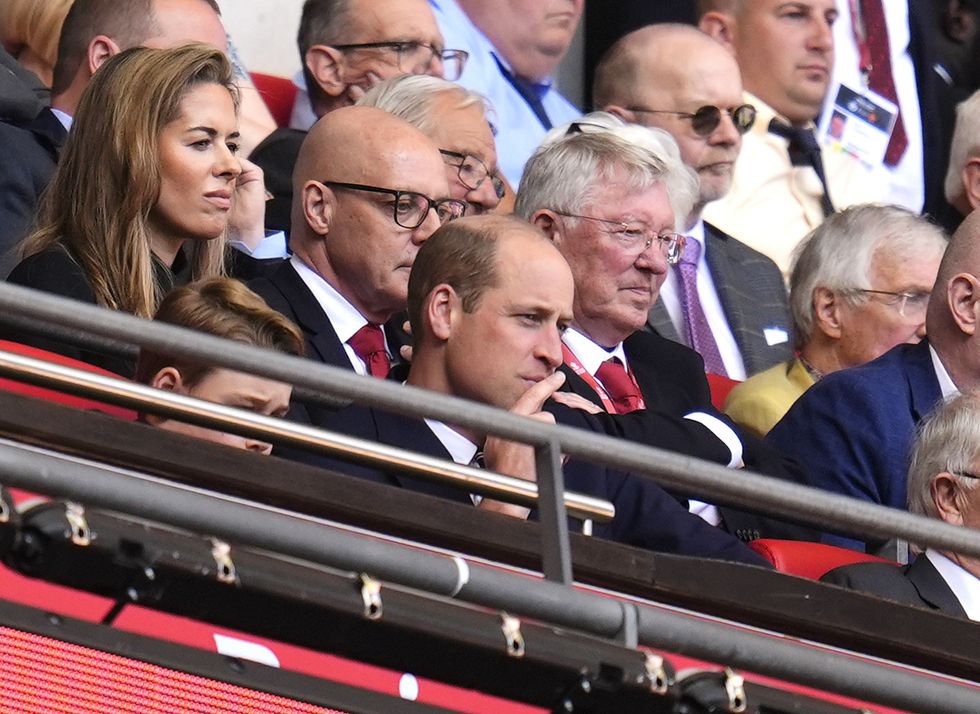 William and George present trophy to FA Cup winners Manchester United