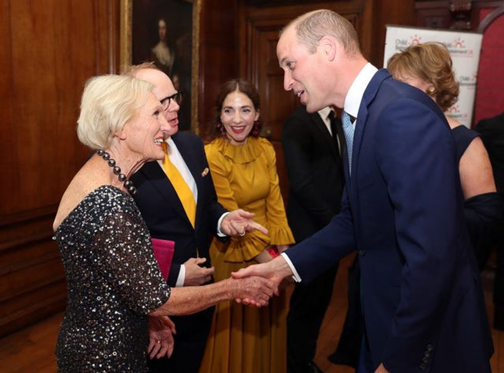 William greeting Mary Berry at a charity gala dinner